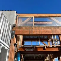 New roof framing going up against open sky