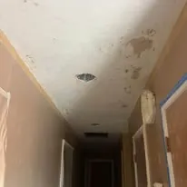 Hallway ceiling after drywall and finishing