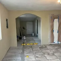 Tile floor running through an arched hallway