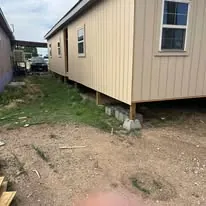 Residential exterior job site with new siding
