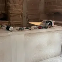 Textured drywall above a finished counter run