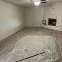 Luxury vinyl plank floor in a living room with a fireplace