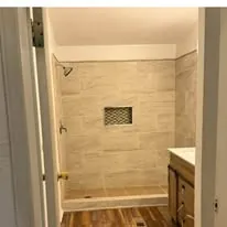 Completed bathroom remodel with a tiled shower, vanity and new floor in Salt Lake City