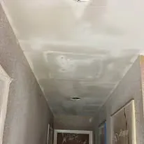 Hallway ceiling skim coated and finished ready for paint
