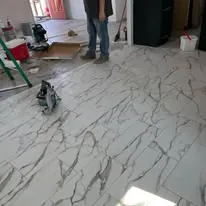 Large marble-look tile part way through installation